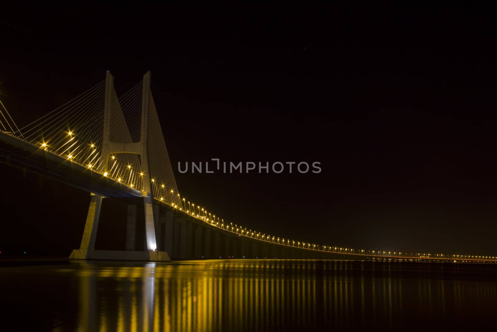 Vasco da Gama bridge on river Tagus, Lisbon at night