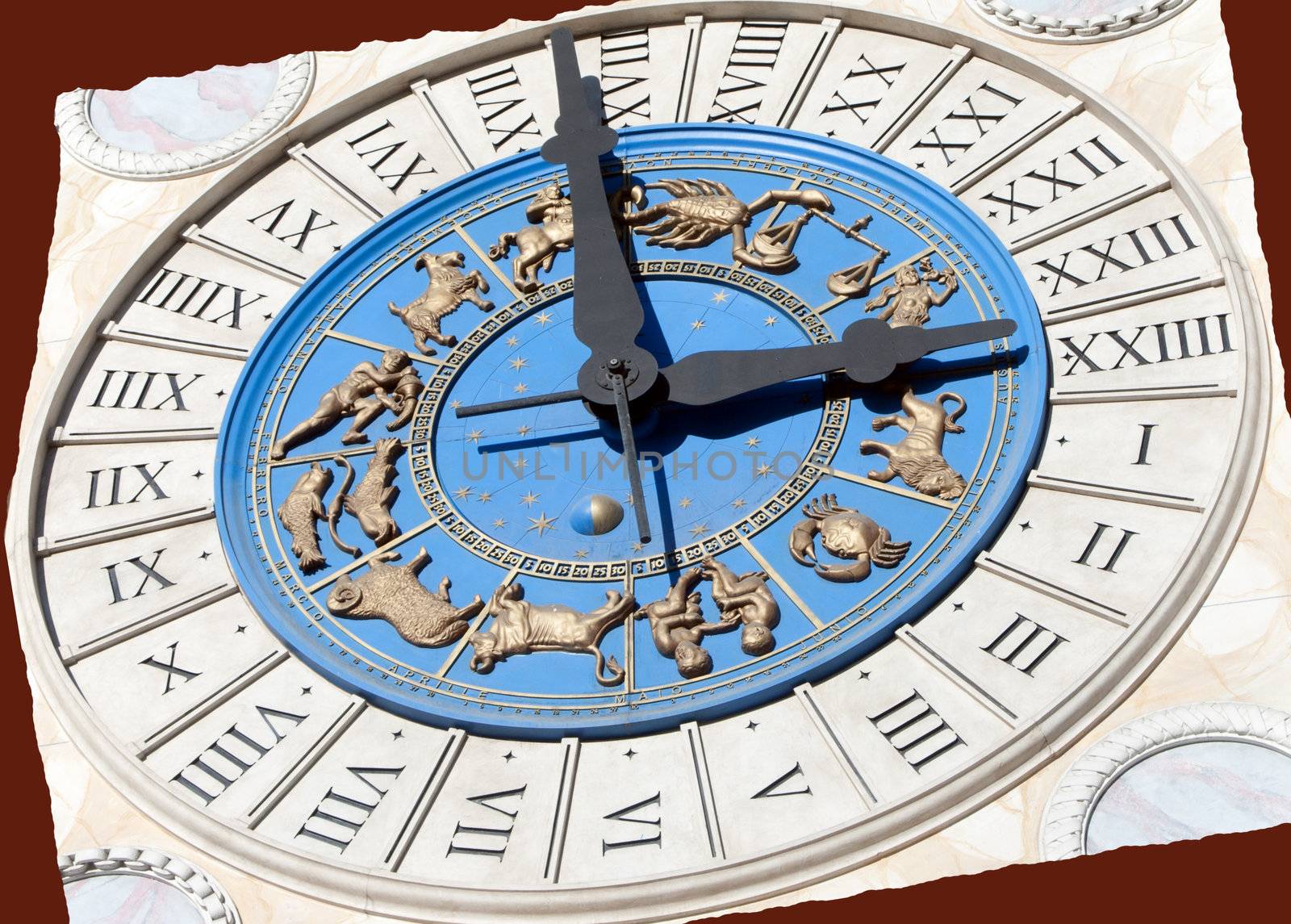 A Roman clock with gold zodiac signs on blue and marble