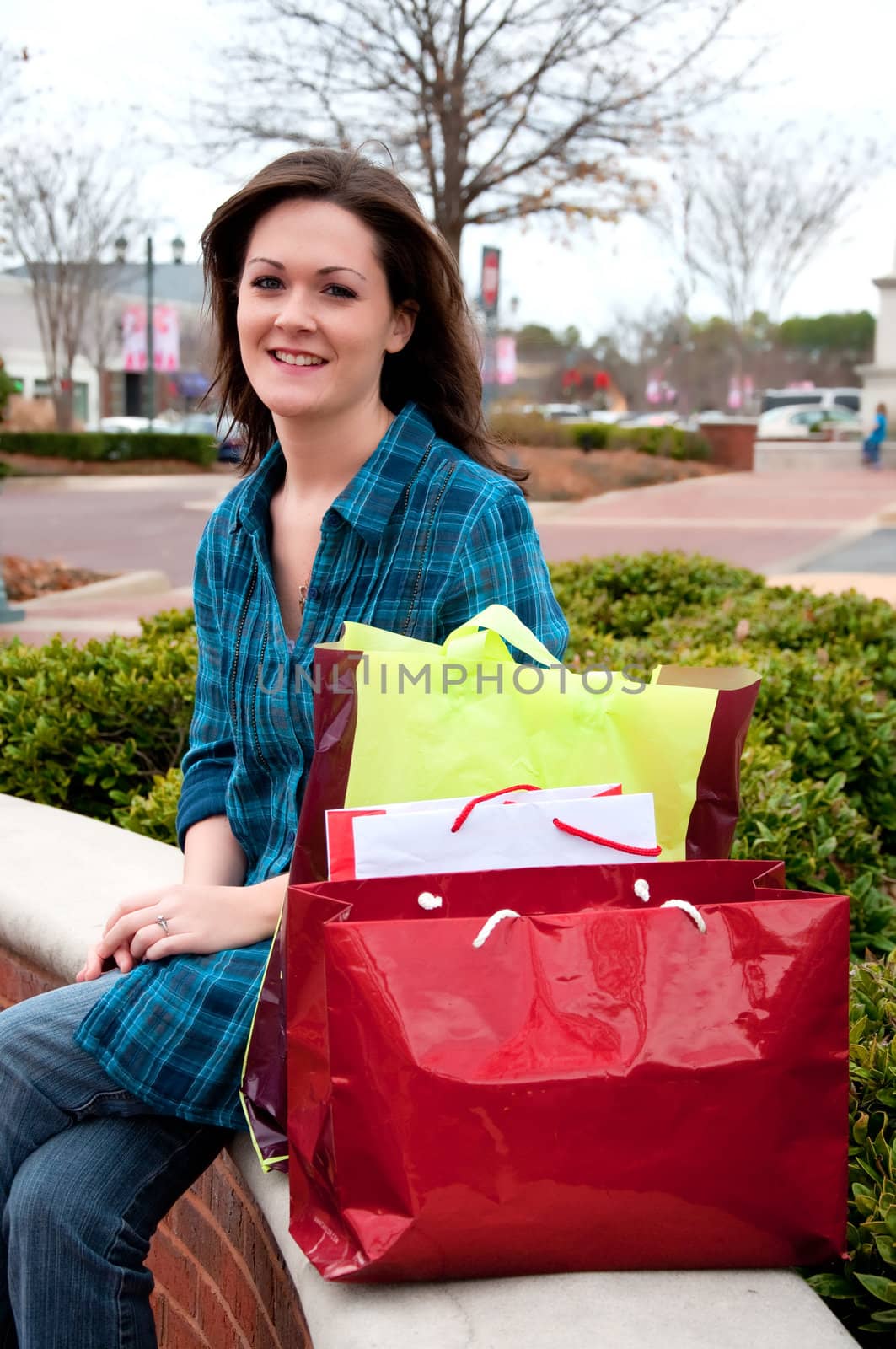Female shopper resting while on shopping spree.