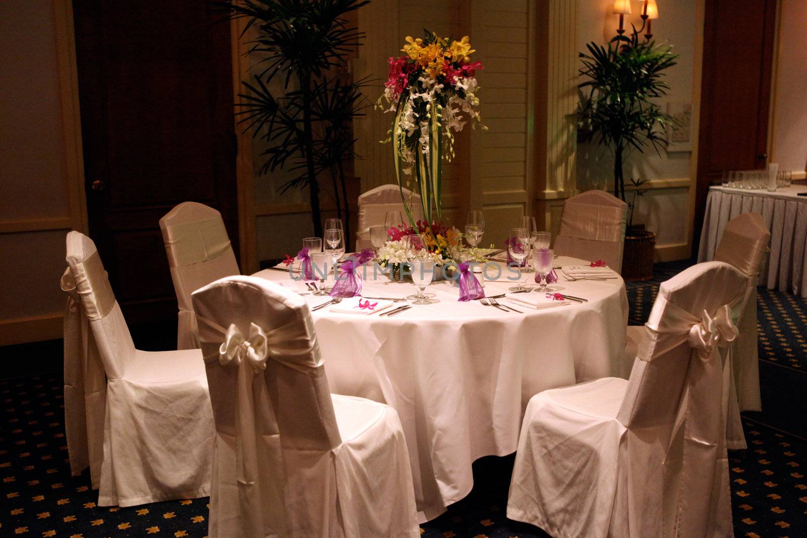 Tables decorated for a wedding reception.