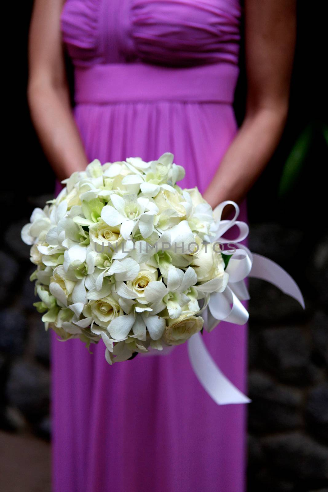 Bridesmaid holding bouquet. by ginaellen
