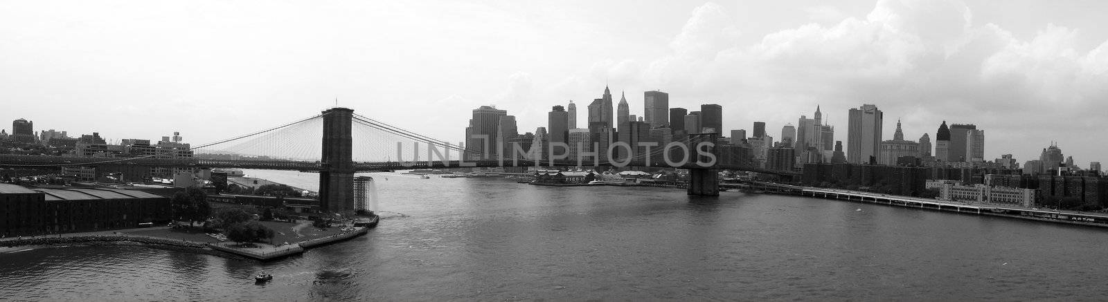 black and white panorama photo of brooklyn and lower manhattan, brooklyn bridge
