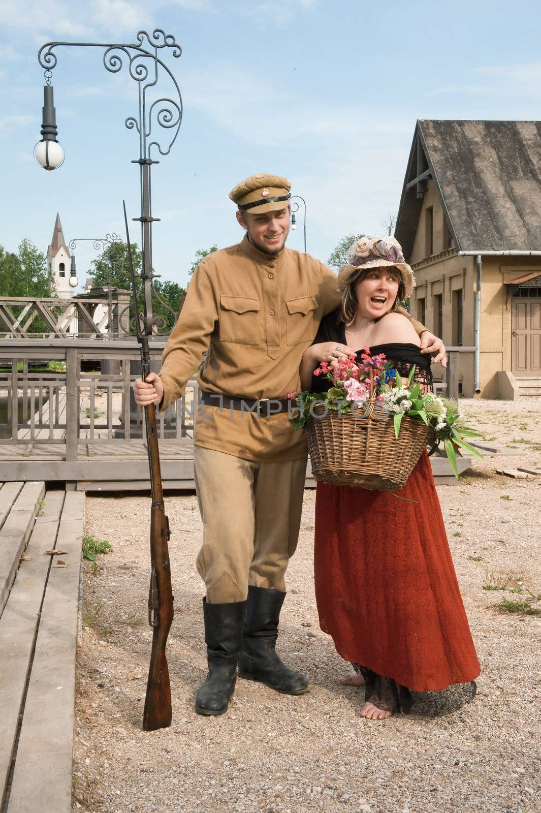 Couple of lady and soldier shown on retro-style picture. Costumes accord the times of World War I. Photo made at cinema city Cinevilla in Latvia.





