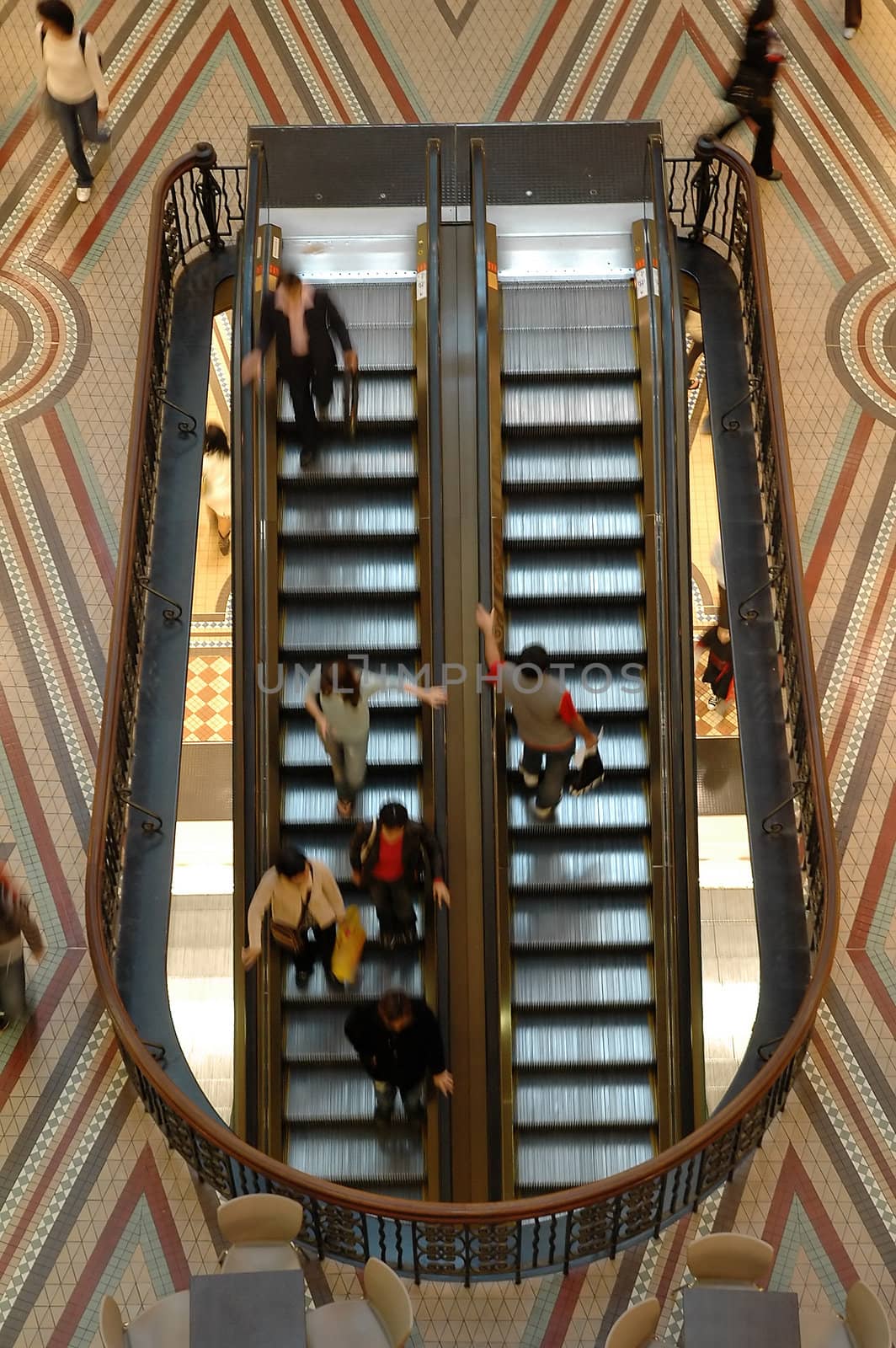 elevators in motion, blured people, photo taken in queen victoria building in sydney