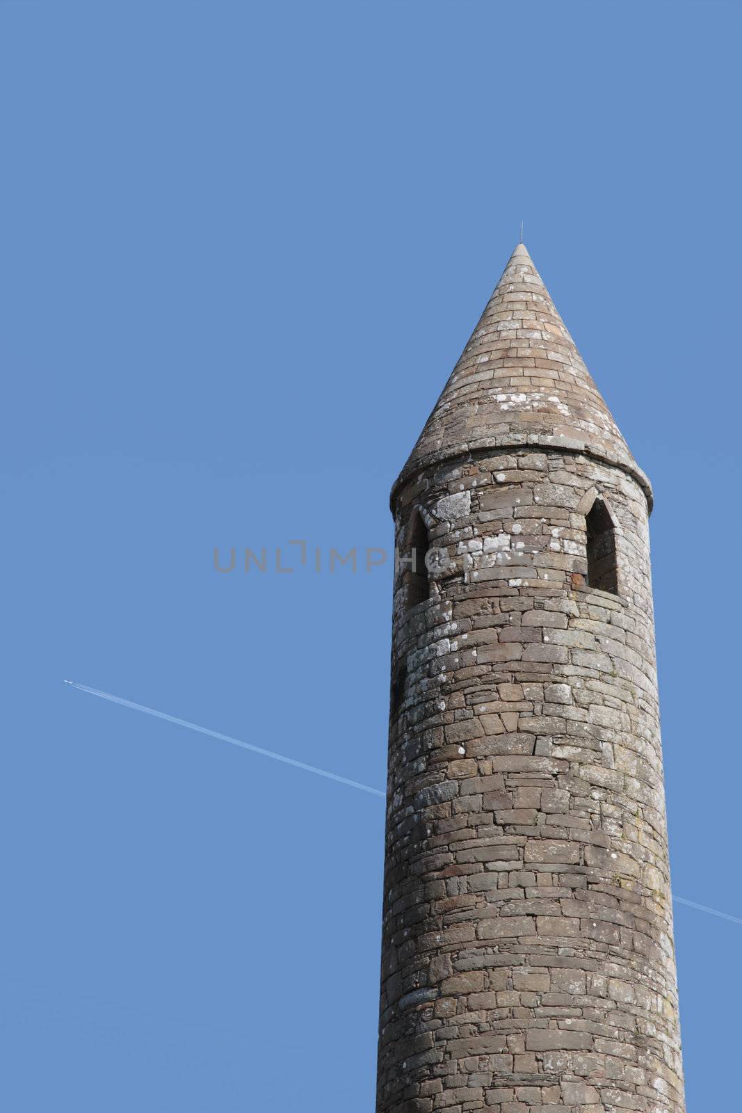 a round tower near ballyduff county kerry ireland with blue sky background