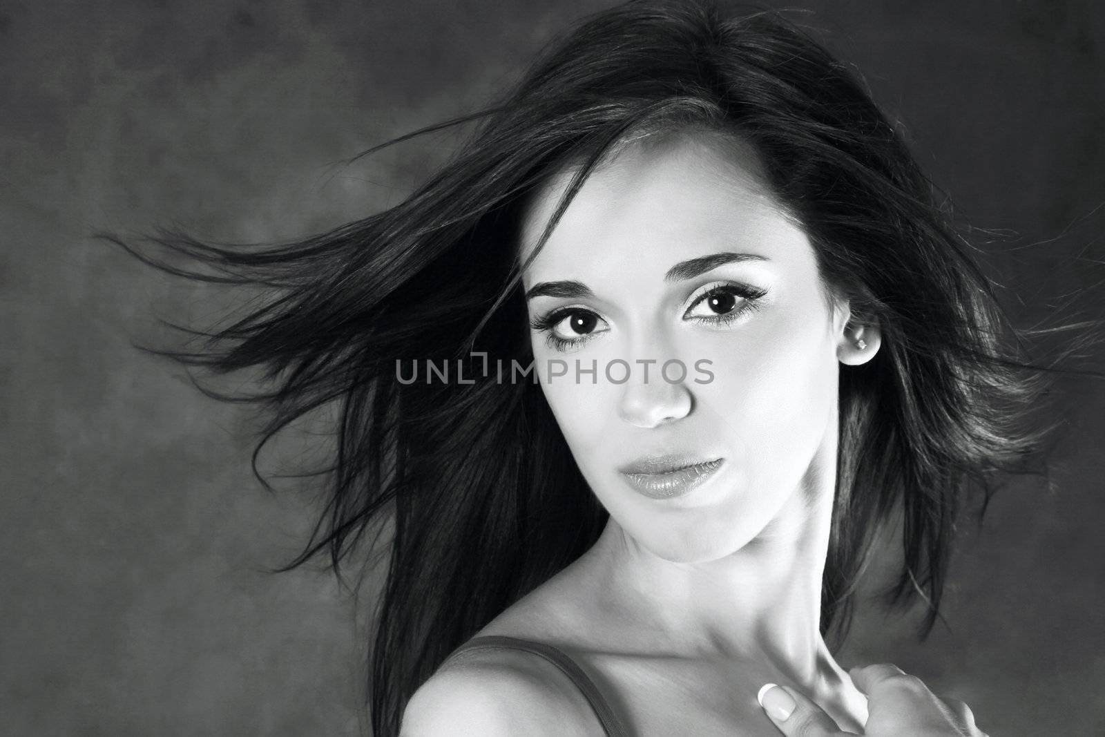 Portrait of the beautiful brunette in studio