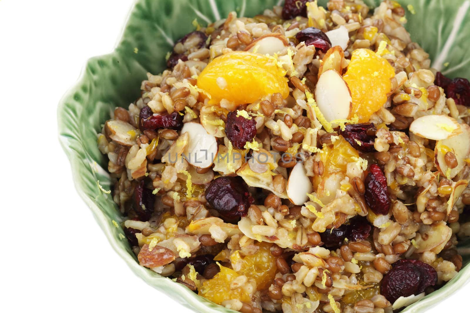 Pilaf with whole grains, nuts, and dried fruit for a delicious side dish or breakfast. Clipping path included.