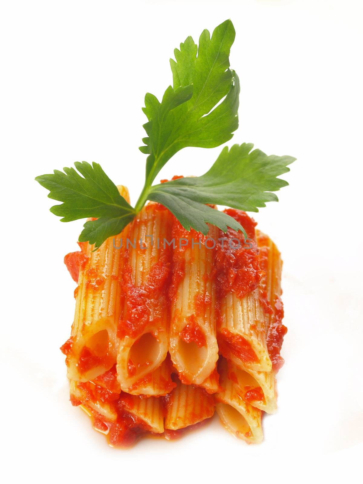 stack of penne pasta in tomato sauce by zkruger