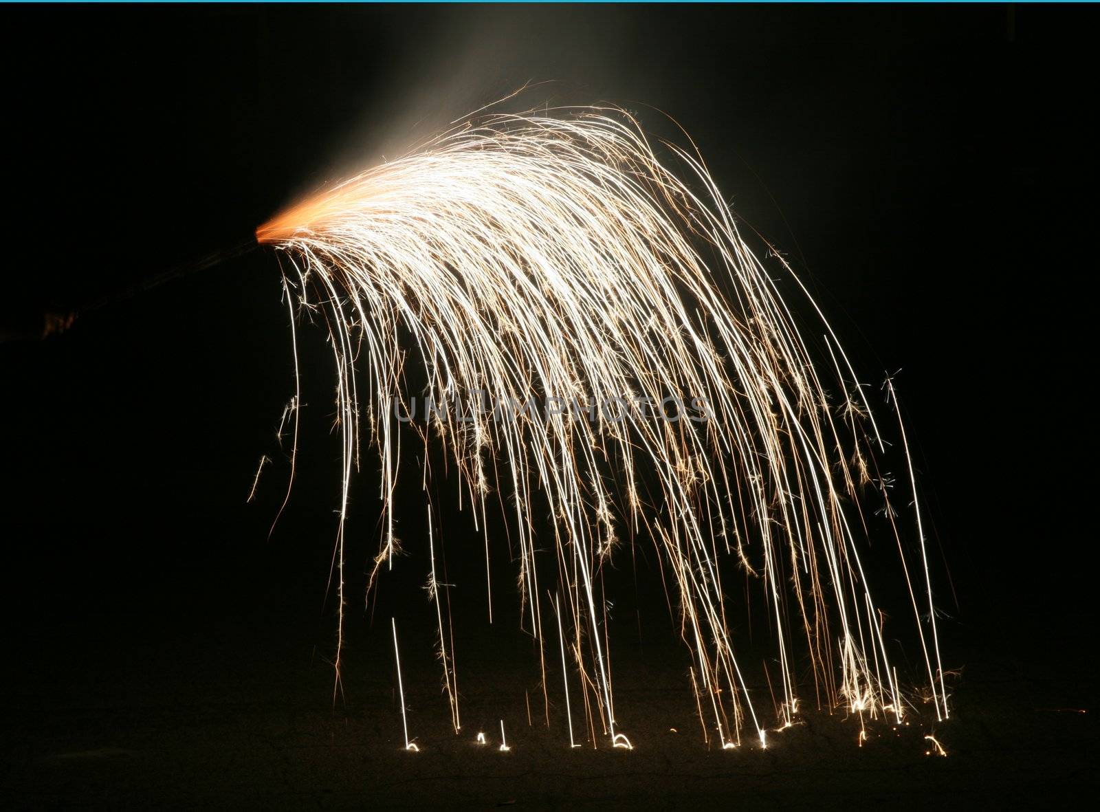 Handheld fireworks streaming to the ground and bouncing