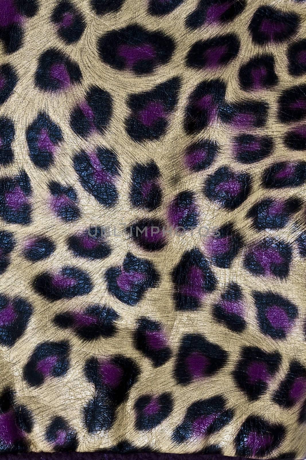 Leopardskin Pattern fabric background  by ibphoto