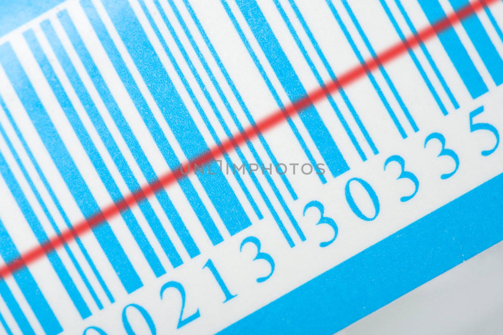 close-up blue barcode with red laser strip