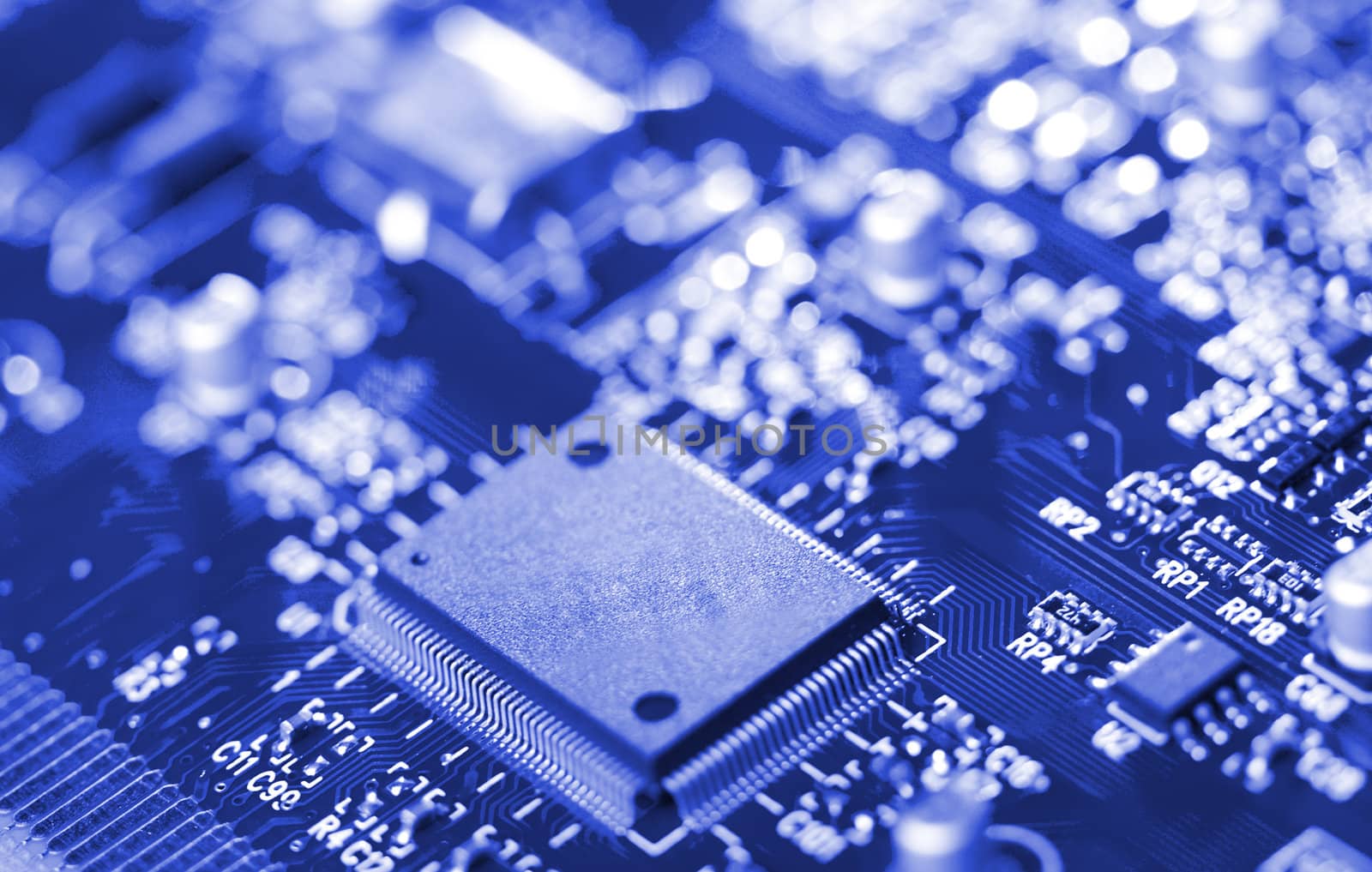 close-up microchip on circuit board, selective focus