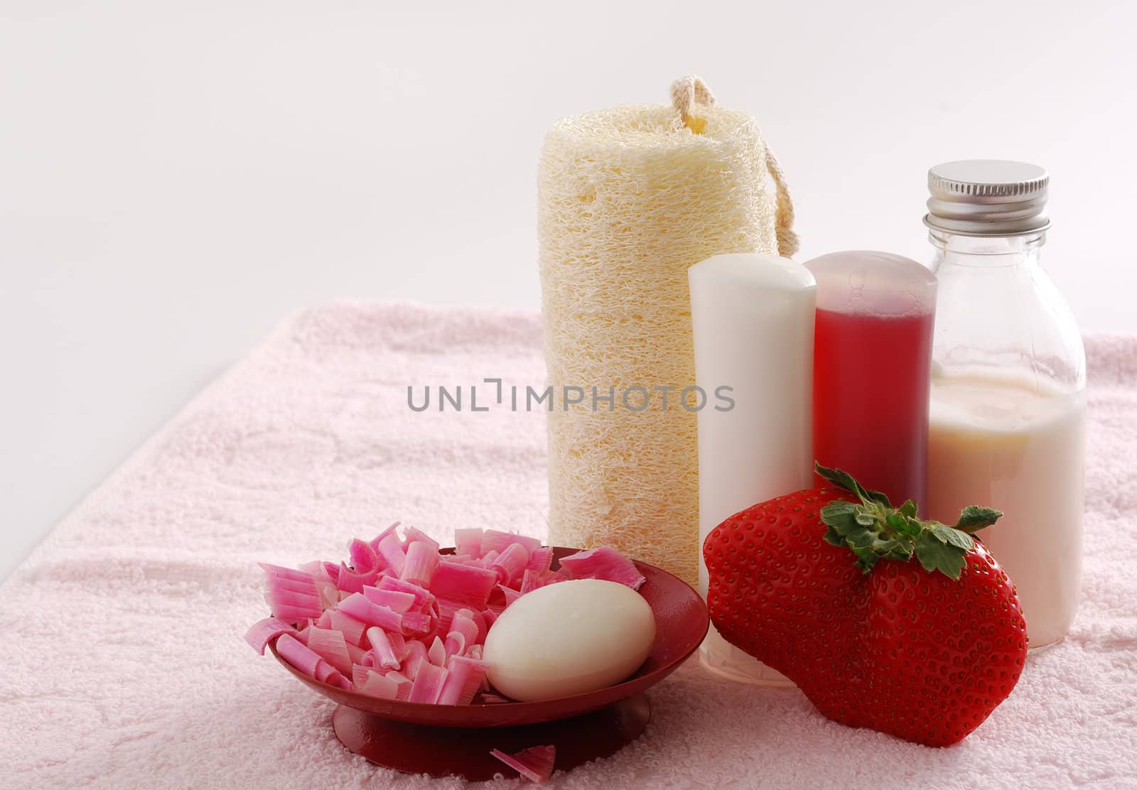 Romantic pink SPA set with huge strawberry including soap, sponge, shampoo and moisturizer