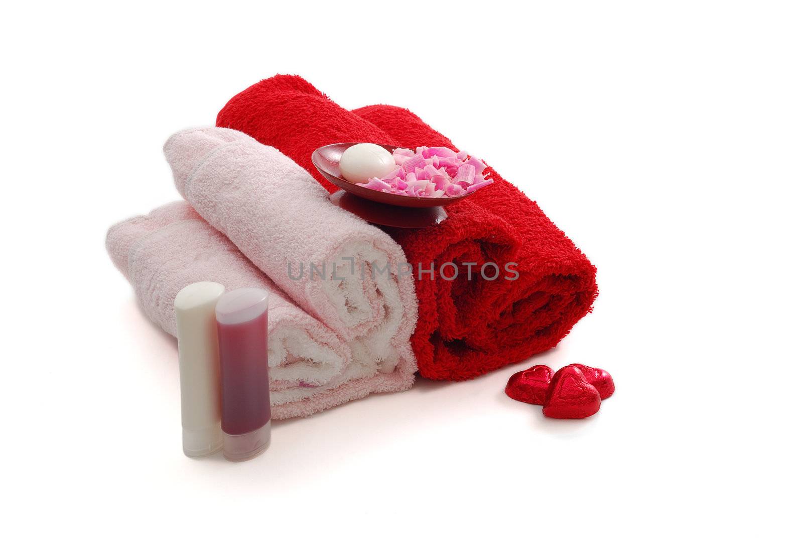 Romantic Valentine Day SPA set including heart shaped towels, soap, candies on white background