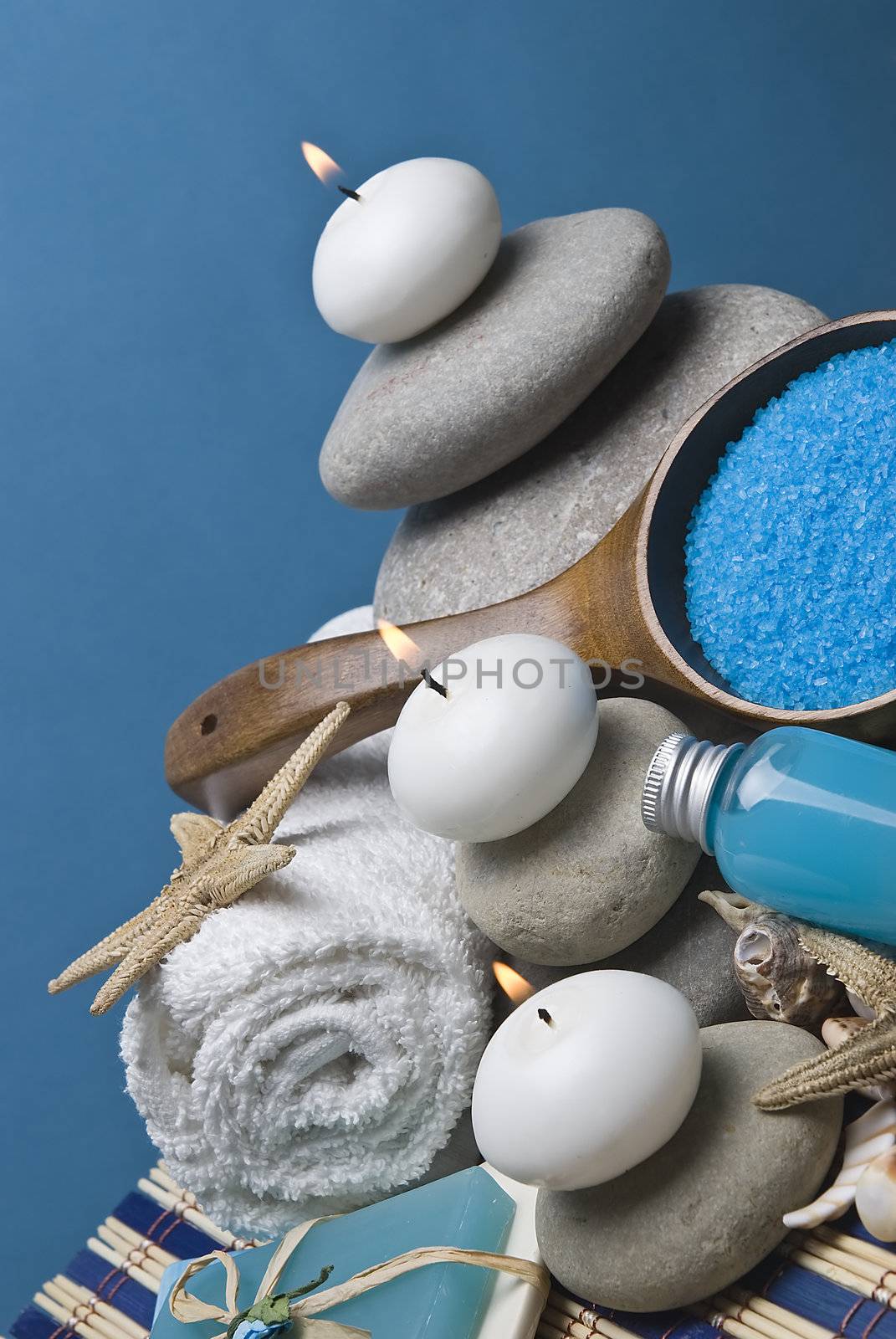 Spa background with hygiene and decorative items in blue.