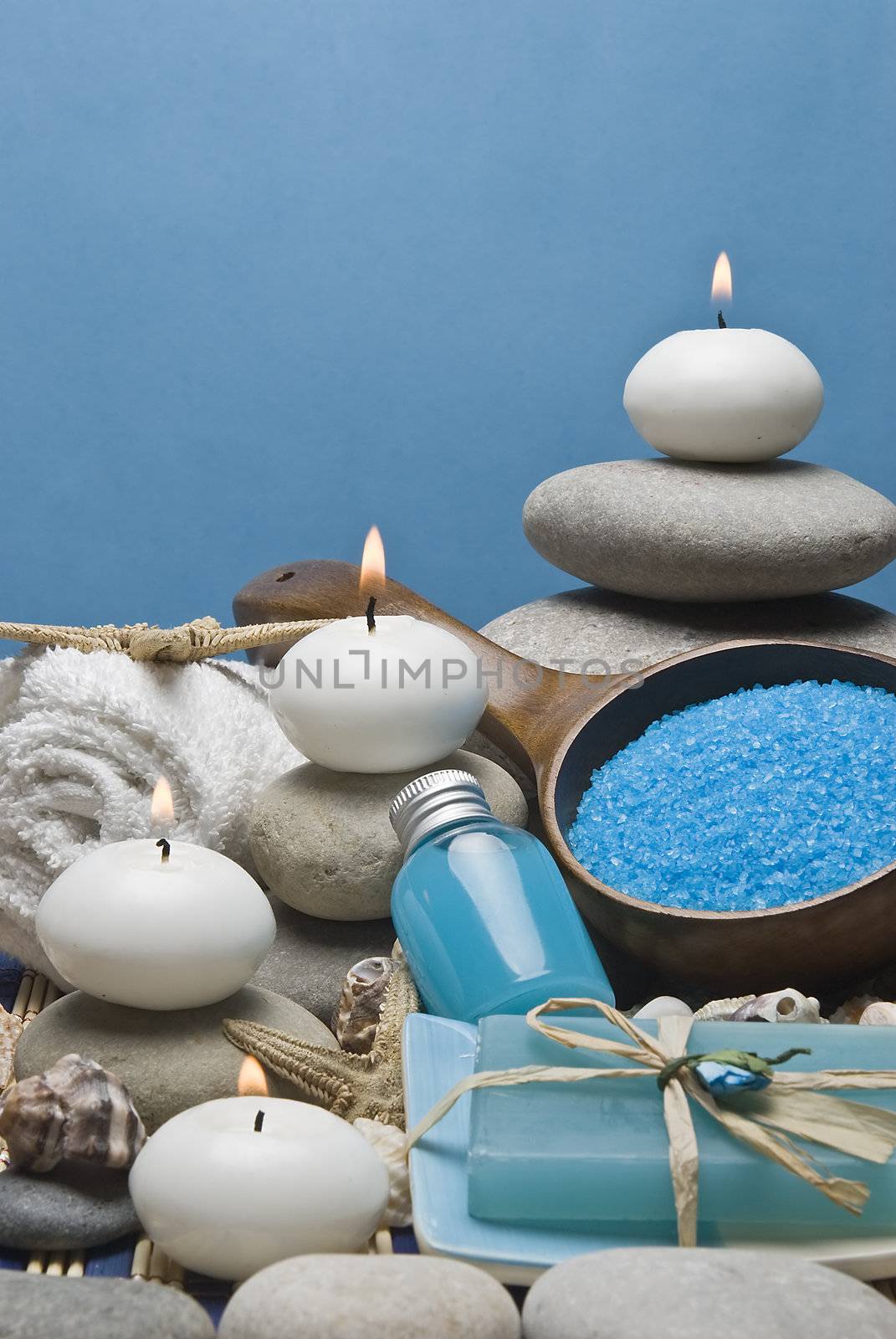 Spa background with hygiene and decorative items in blue.