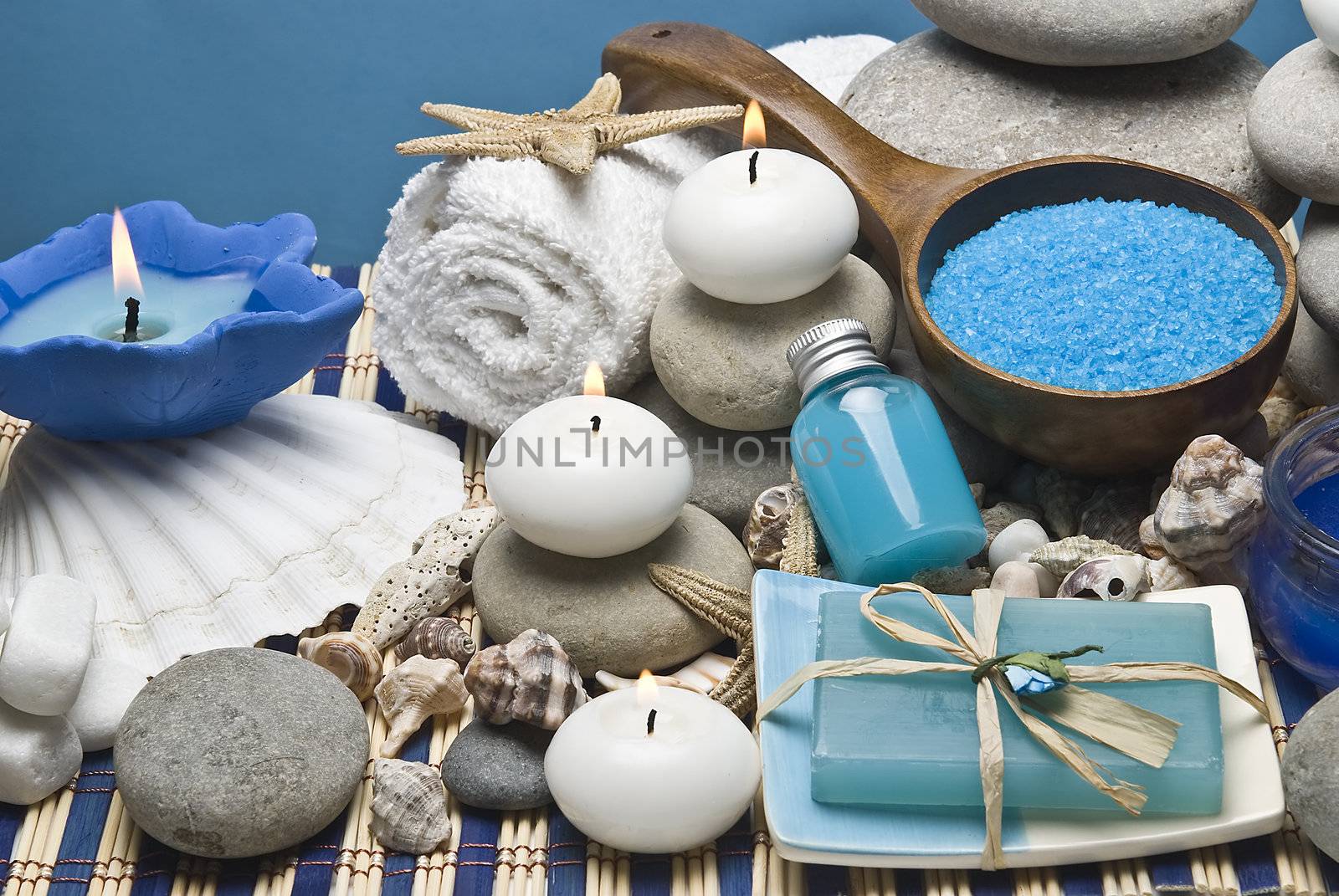 Spa background with hygiene and decorative items in blue.