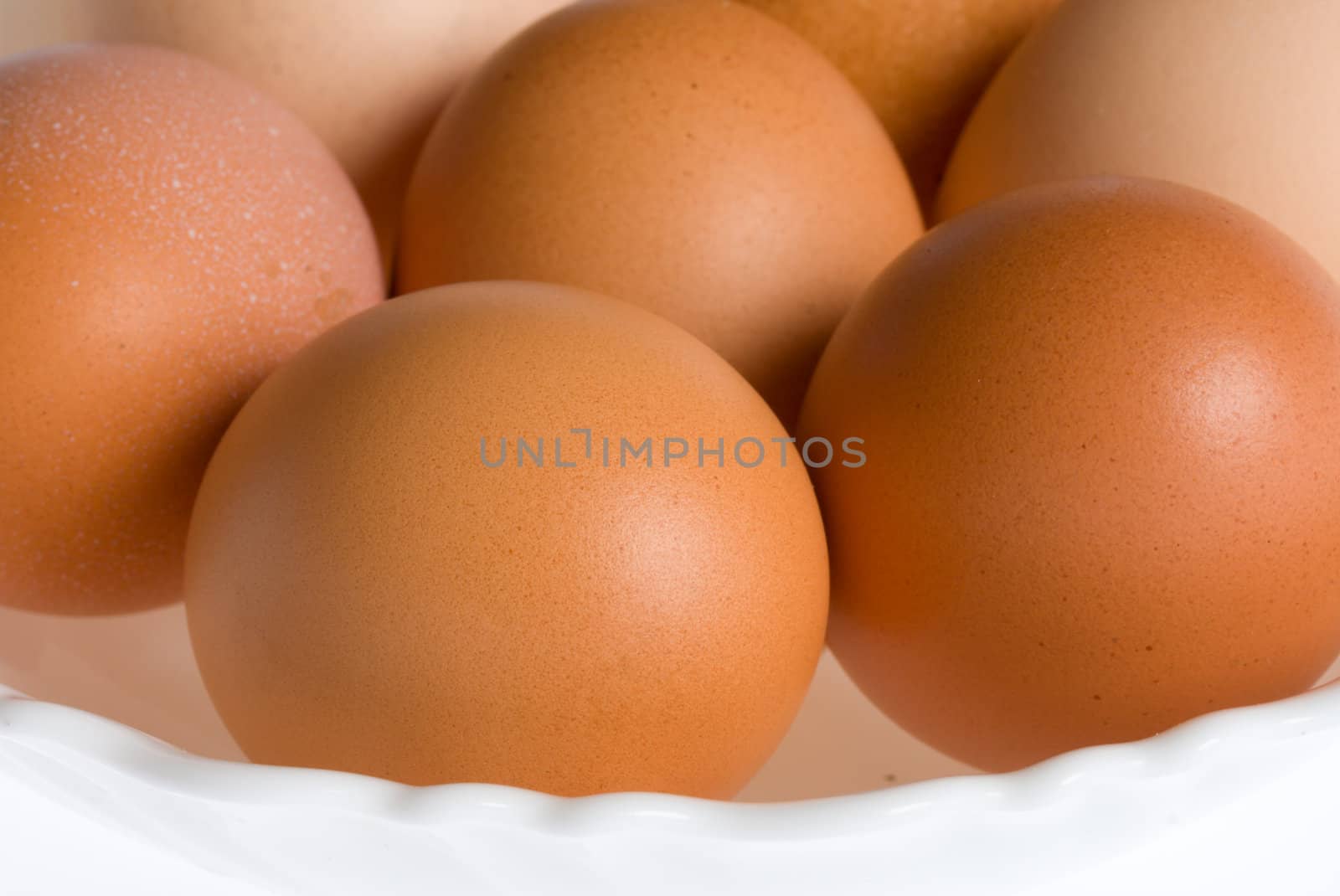 close-up eggs on plate, isolated over white