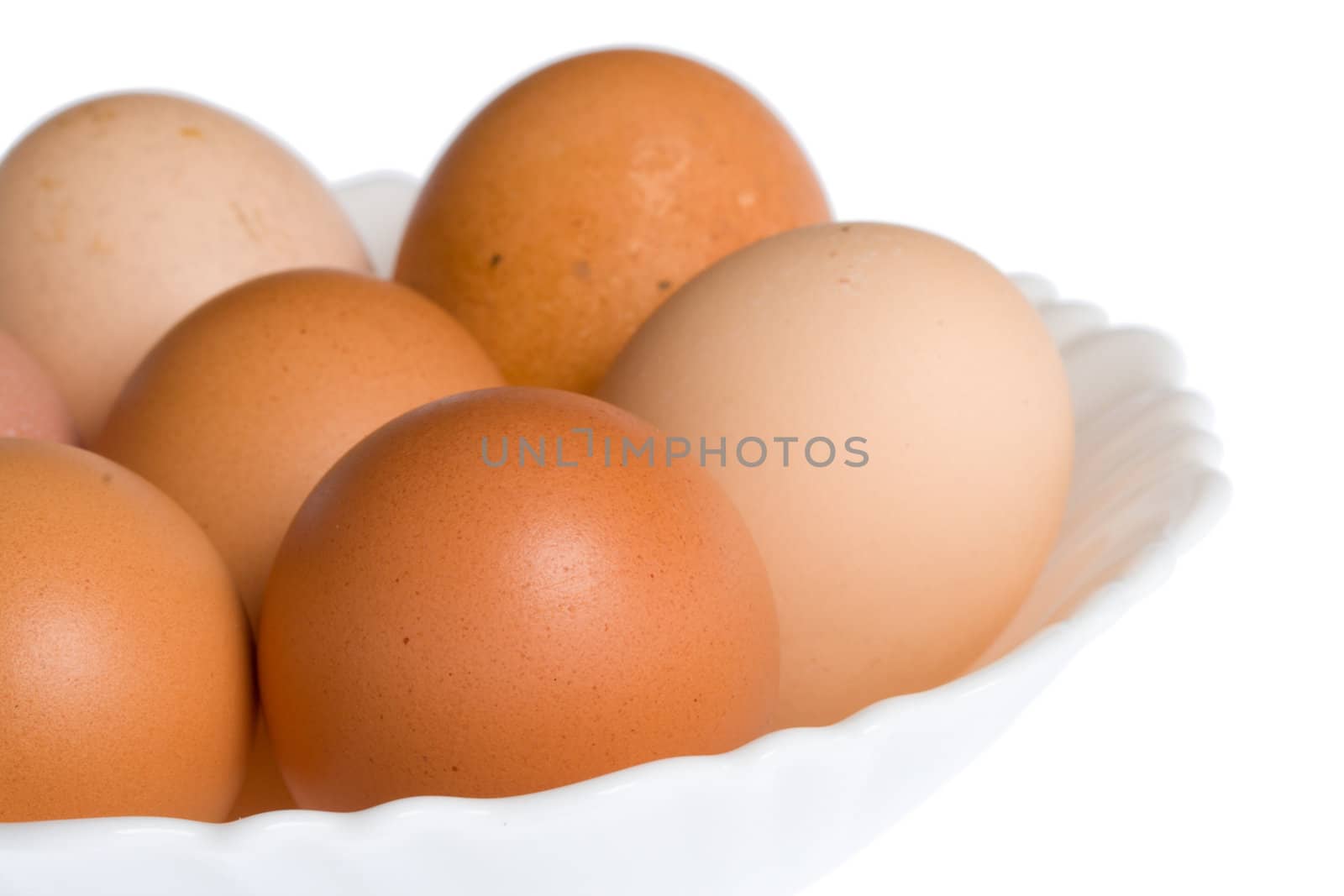 close-up eggs on plate, isolated over white