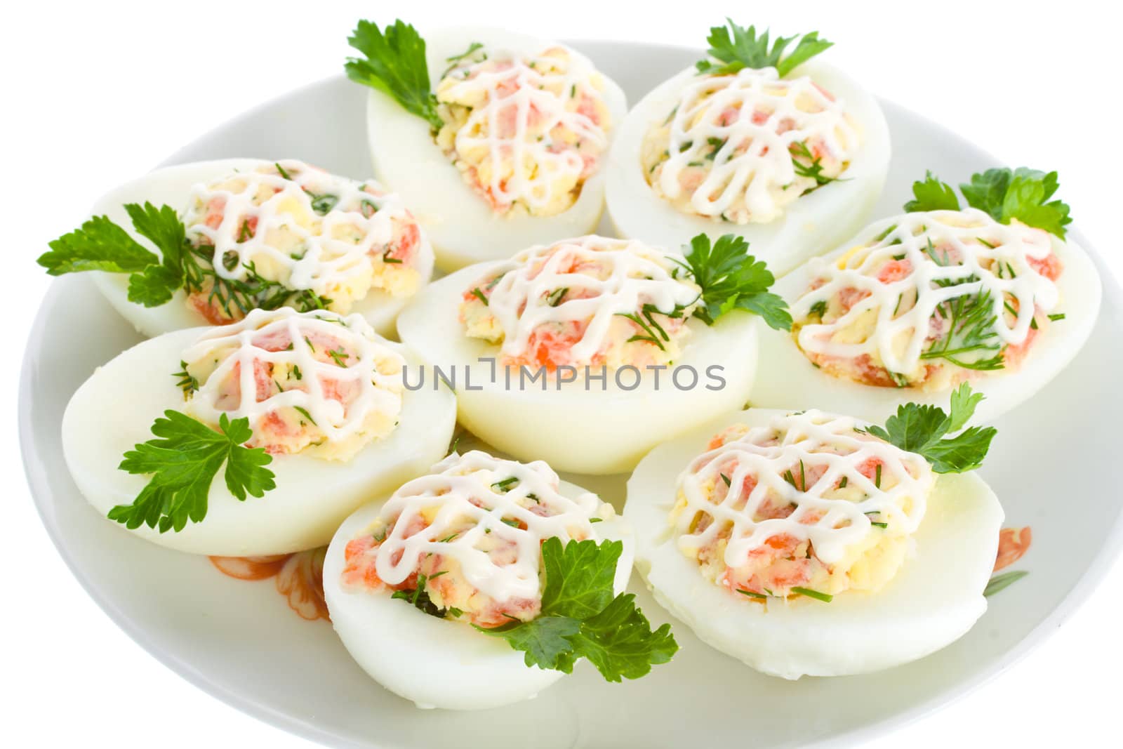 close-up eggs stuffed with red fish, view from above, isolated on white