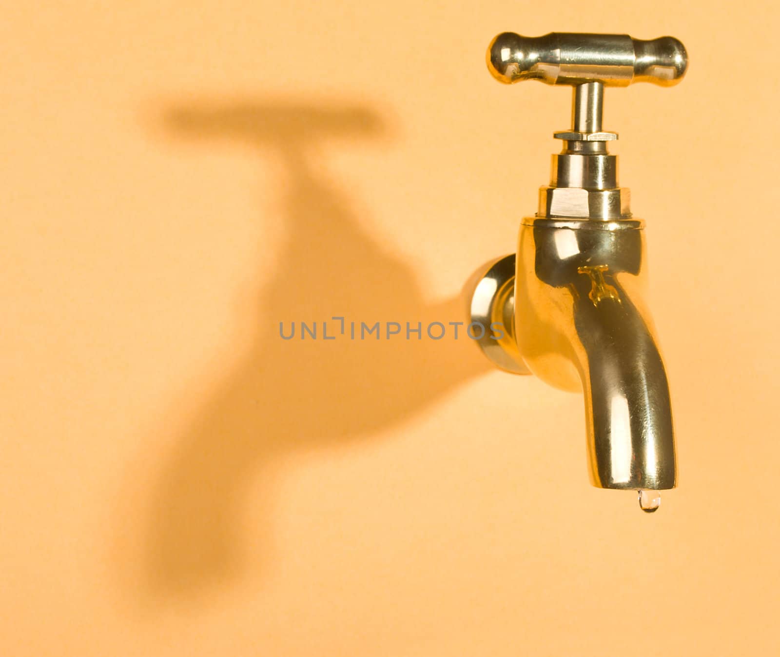 faucet in orange wall with water drop by Alekcey