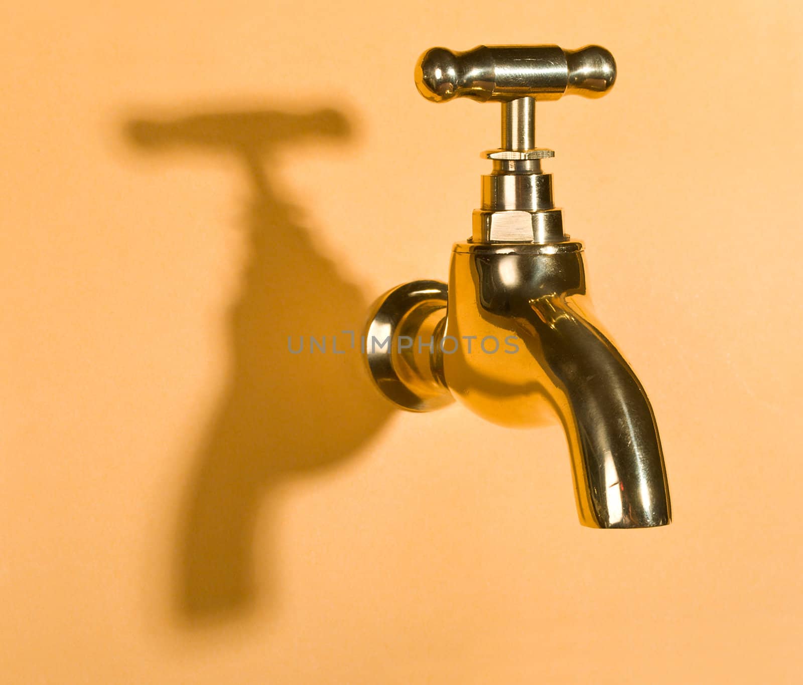 faucet in orange wall by Alekcey