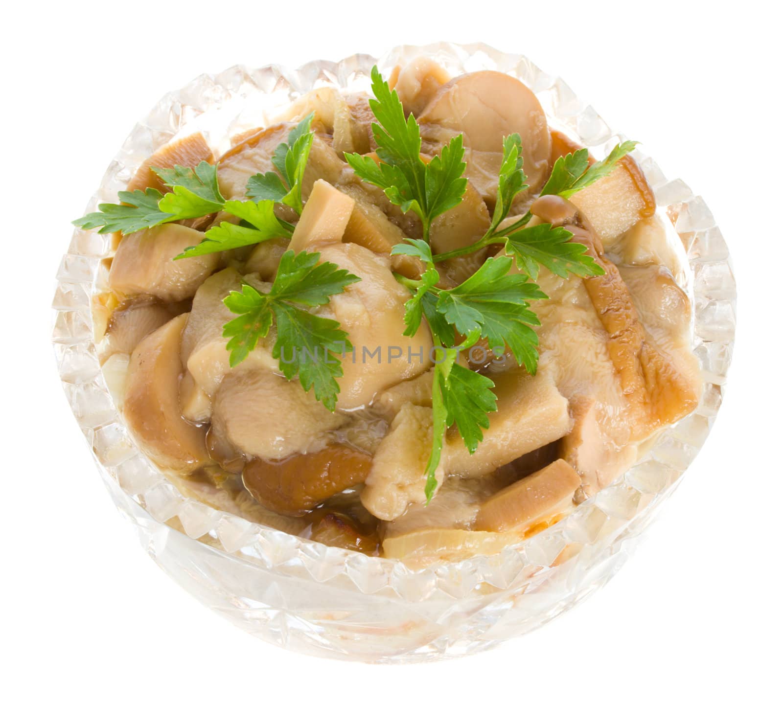 pickled mushrooms in bowl with parsley, isolated on white