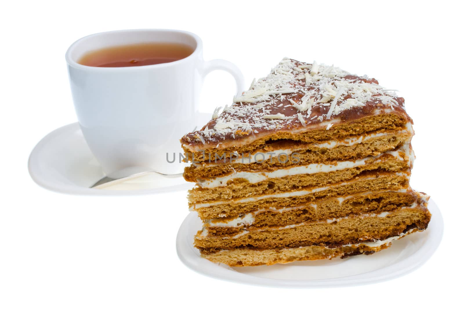 piece of honey cake and tea cup, isolated on white