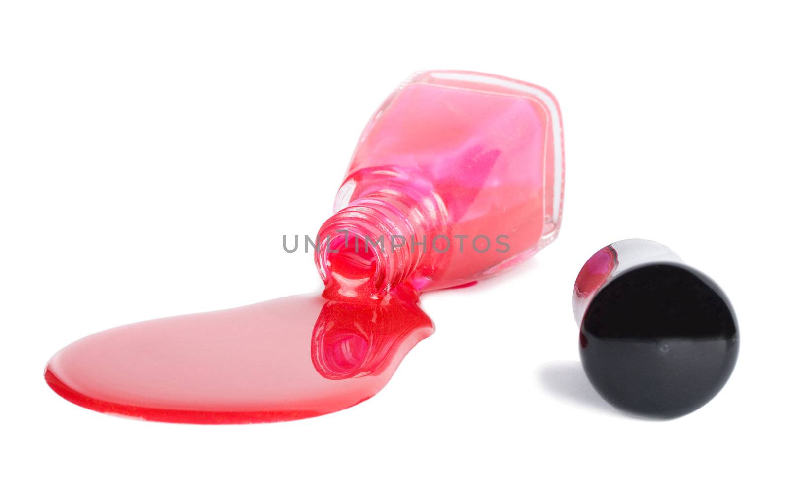 red nail lacquer spilling, isolated on white