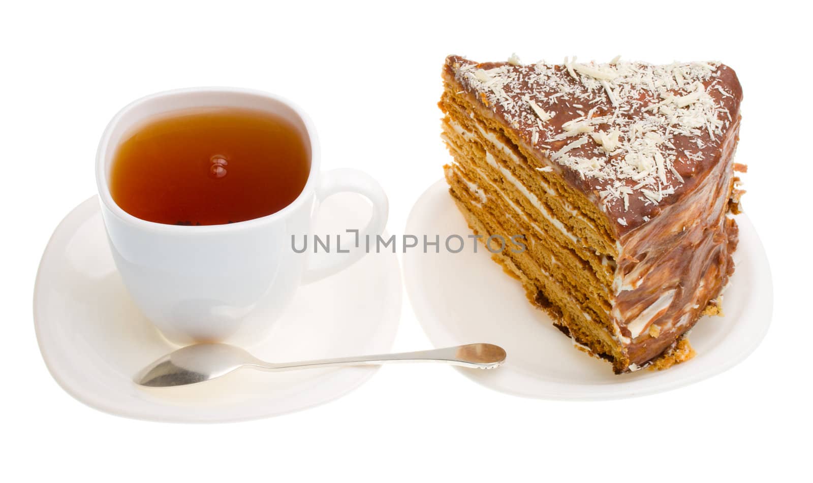 tea cup and piece of home made honey cake by Alekcey