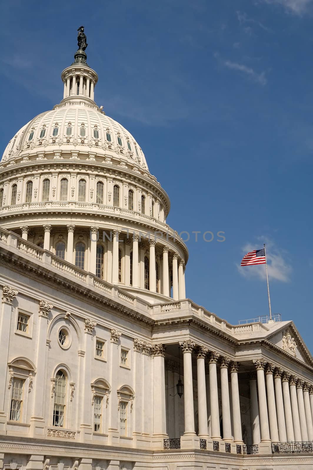 The Capitol building in Washington DC, waving american flag