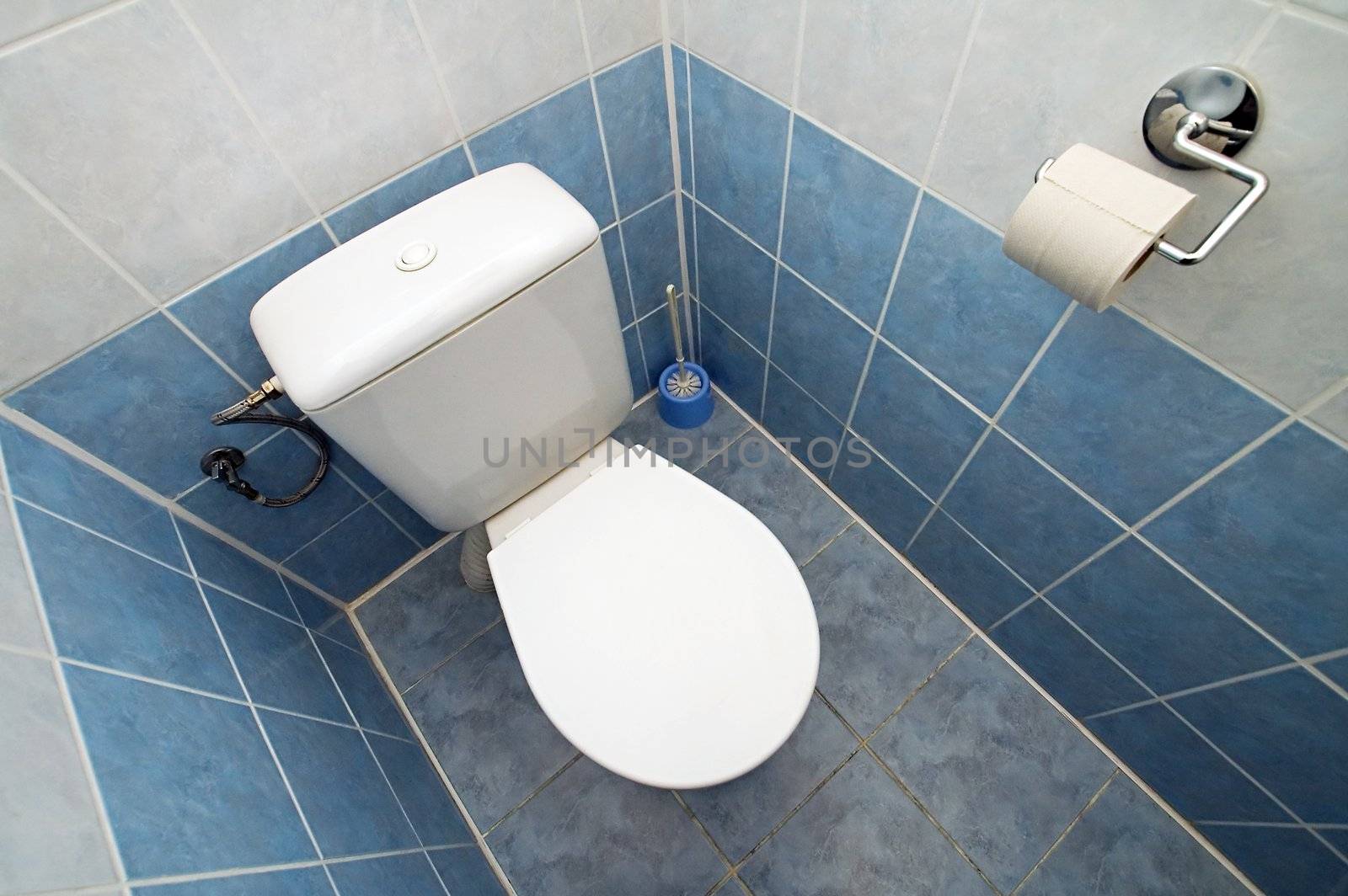 white clean toilet, white and blue tiles