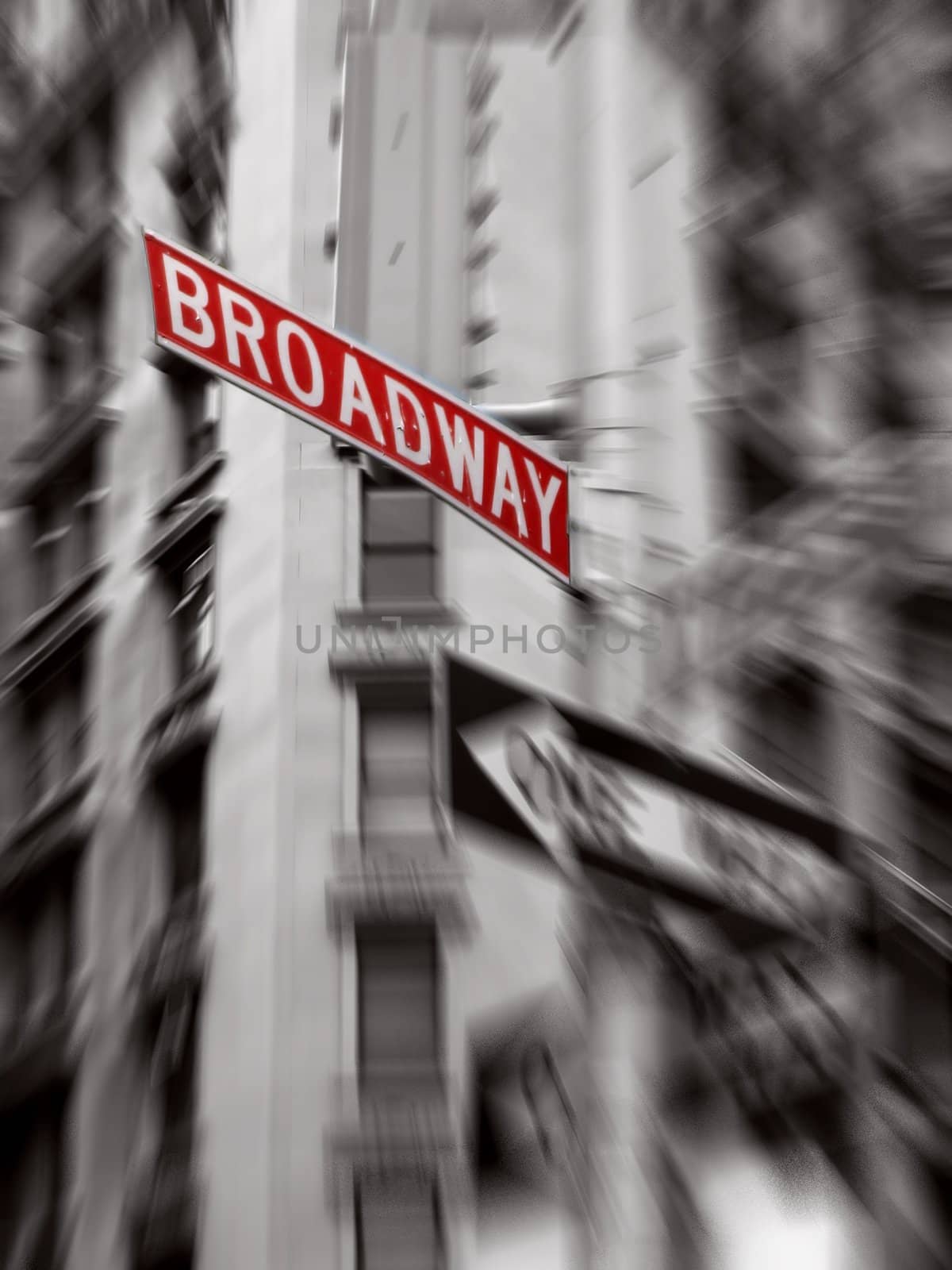 red broadway sign, black and white photo, zoom blur