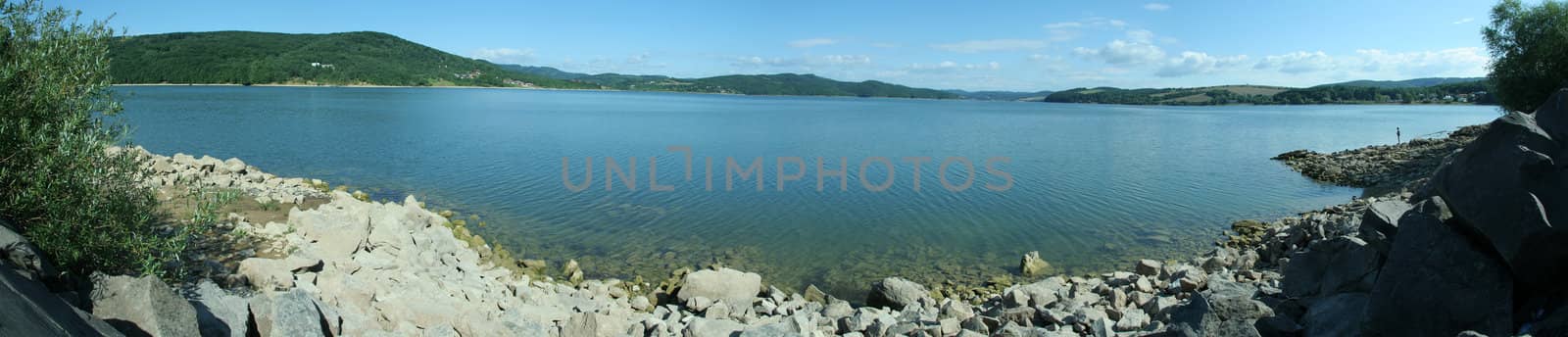 blue lake panorama, fisherman silhouette on right side, photo taken at Domasa, Slovakia
