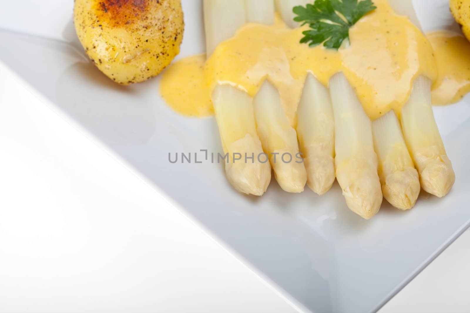 white asparagus and sauce hollandaise by bernjuer