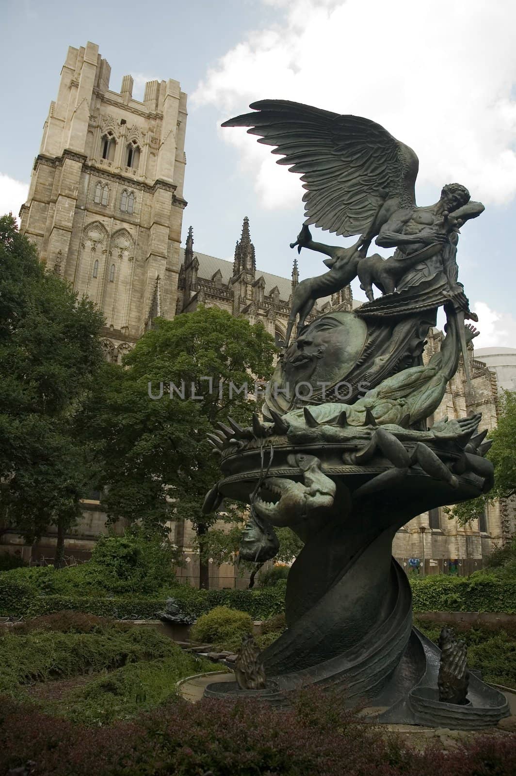 angel statue in childrens sculpture garden, Cathedral Church of Saint John the Divine in background