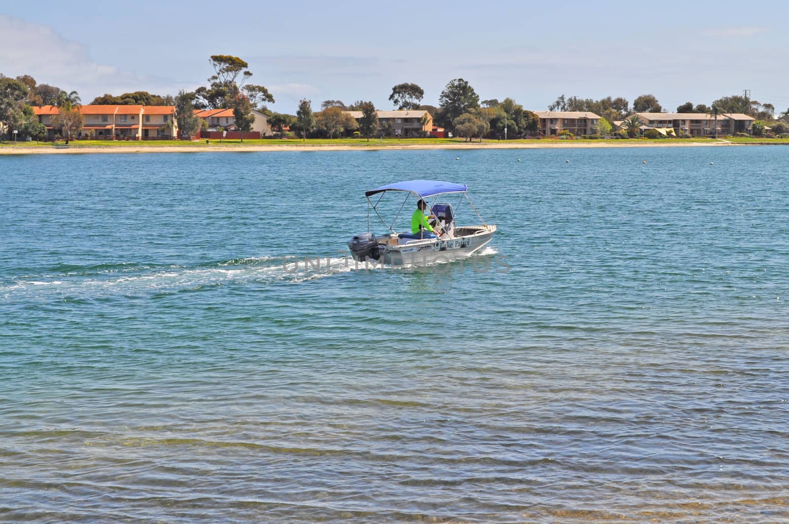 Little boat on the blue sea water lake