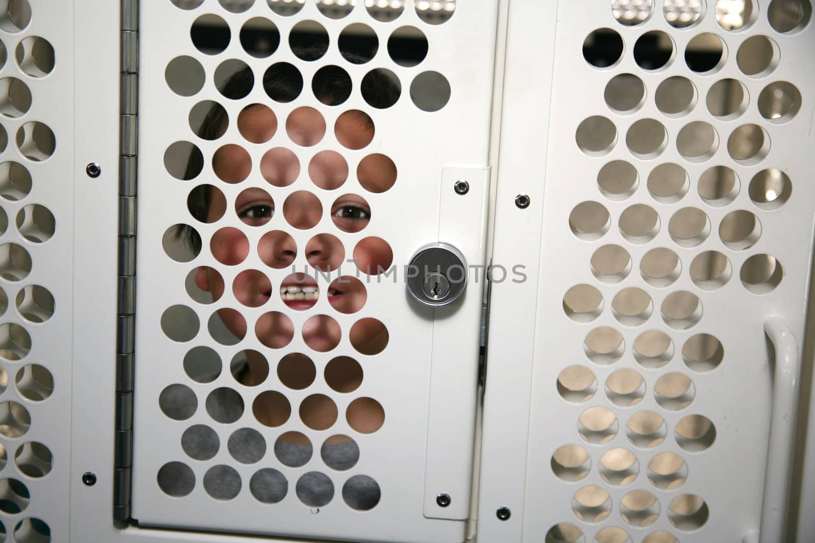 Juvenile delinquent in an individual cell on a police transportation bus