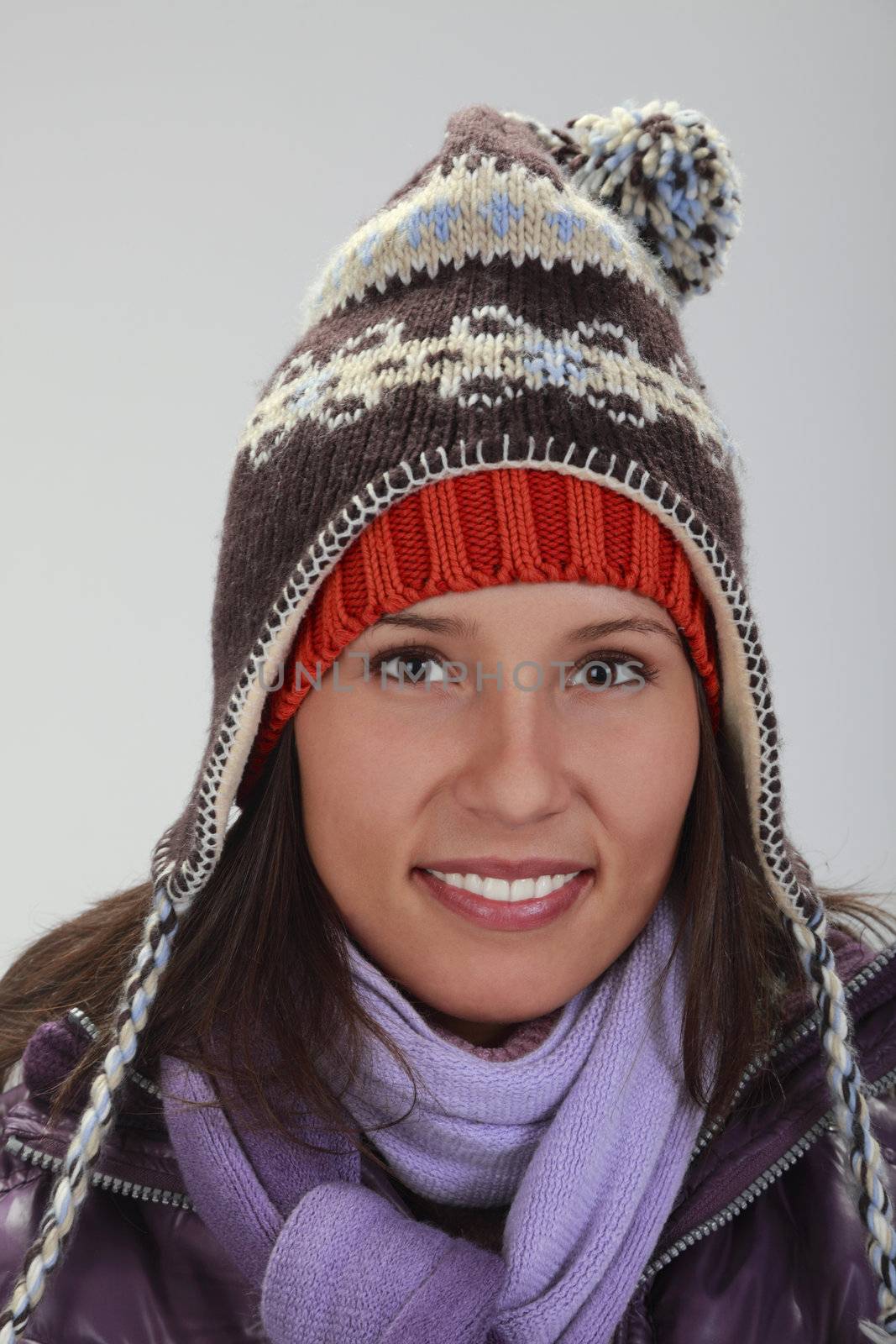 Portrait of a beautiful young woman with winter hats.