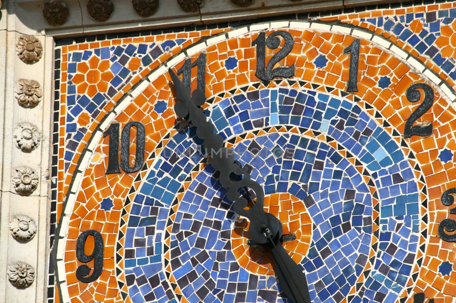 Old ceramical clock at the top of the tower
