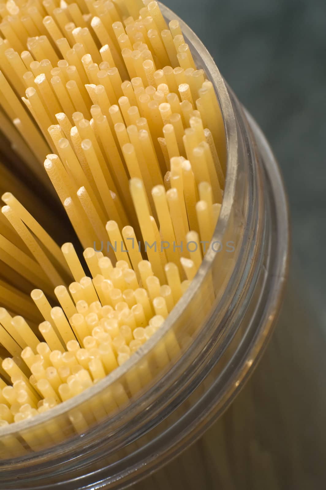 spaghetti in a plastic container, detail abstract photo