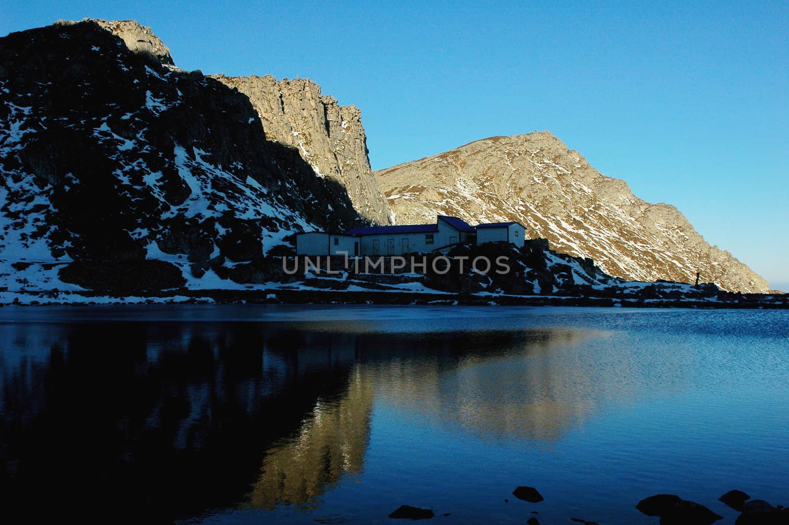 Landscape of mountains at lakeside in winter