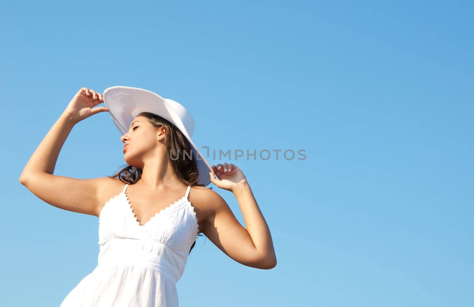 Freedom girl in the sky with white hat and dress