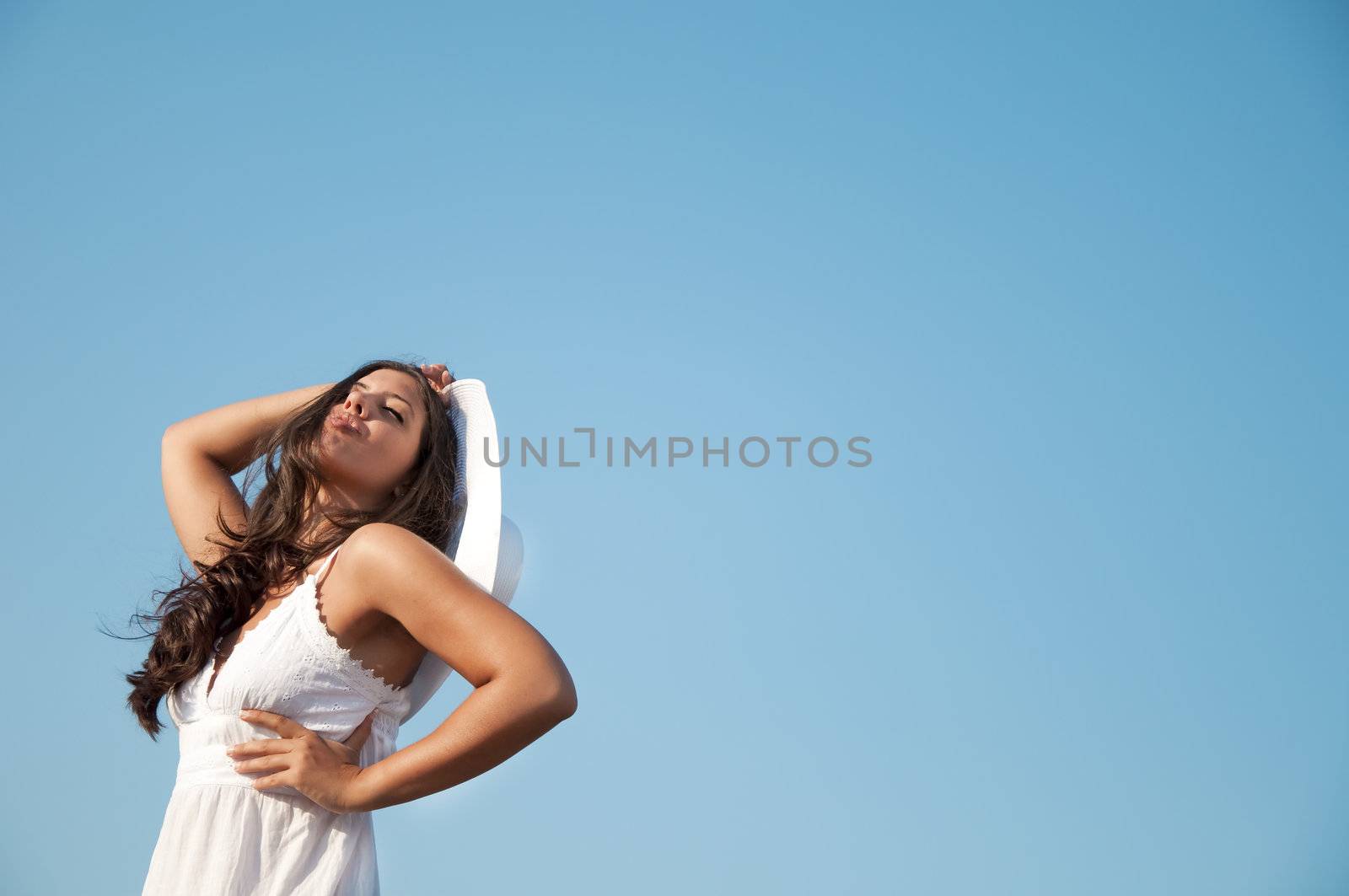 Freedom girl in the sky with white hat and dress