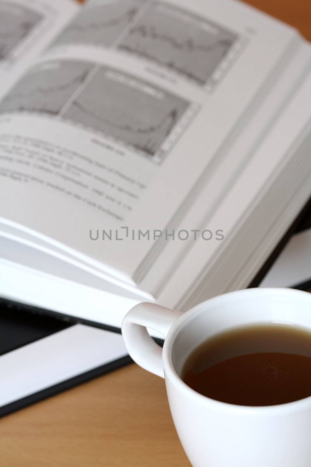 A cup of coffee and an investment book