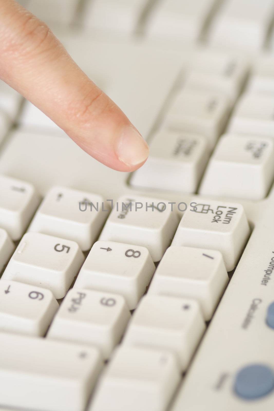 Finger on keyboard typing