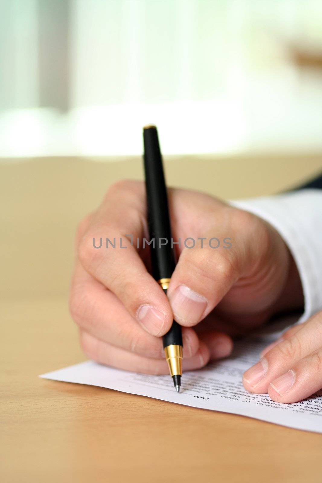 Businessman filing out a form