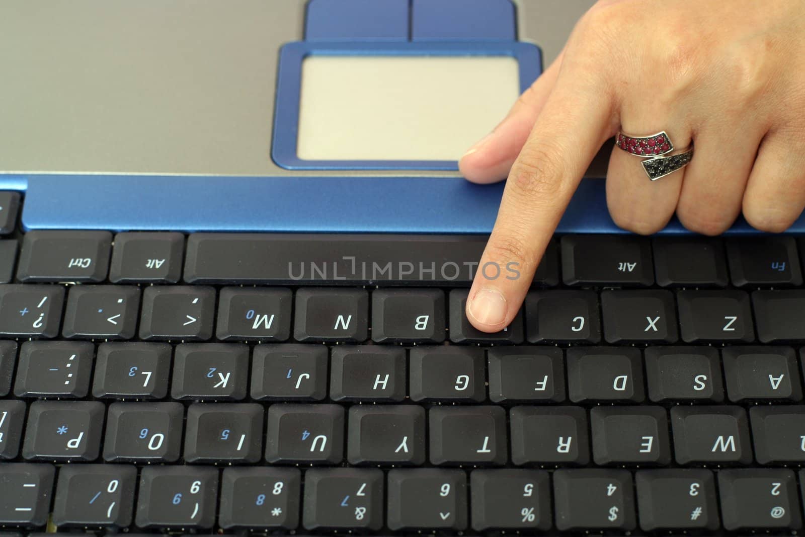 Business woman typing on a laptop