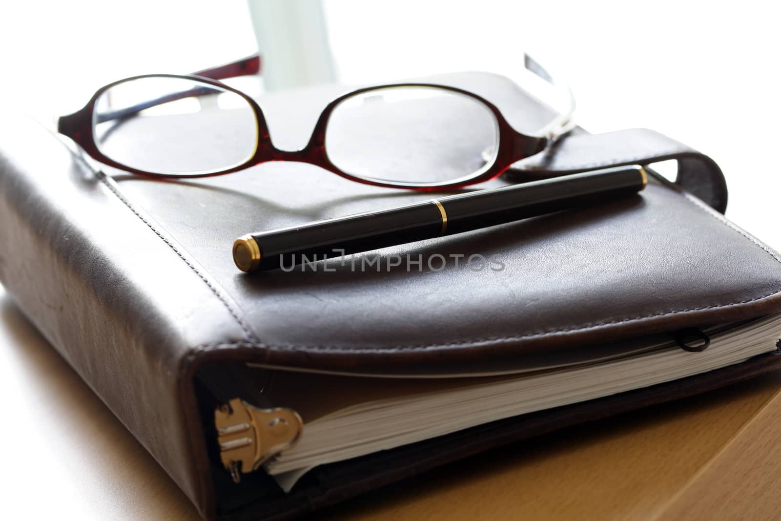 An organizer and a pair of glasses