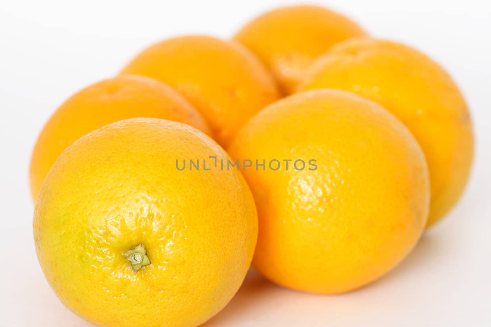 Oranges over white background